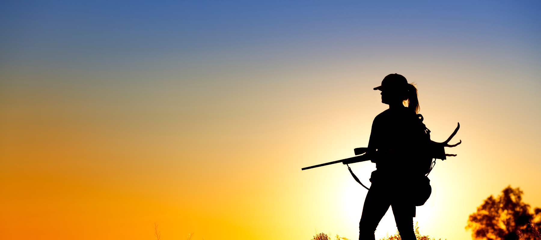 Hunter silhouette at sunset