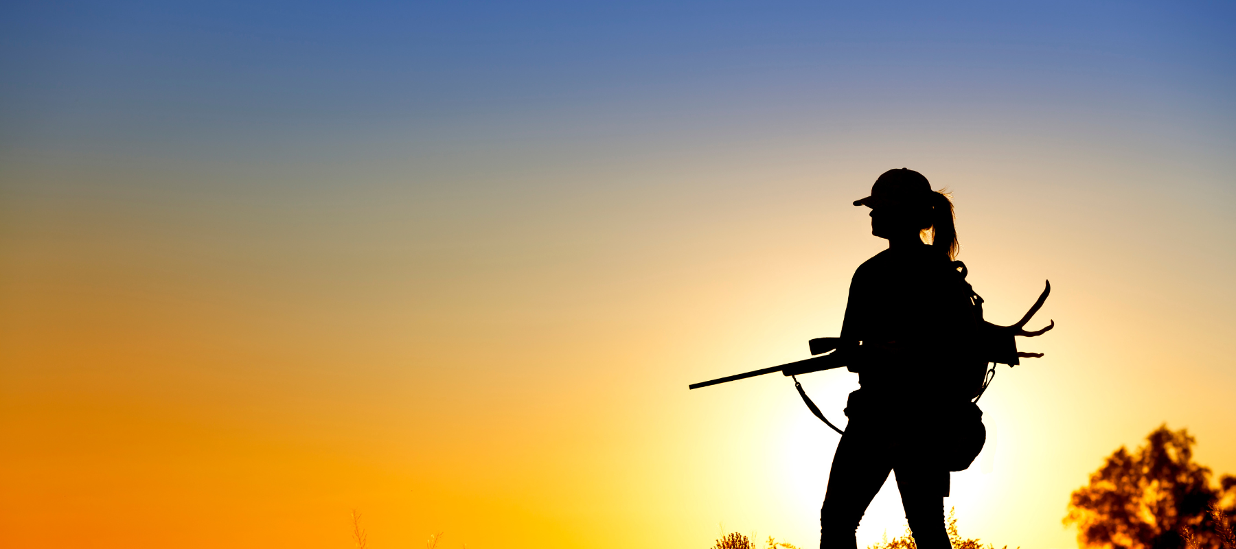 Hunter silhouette at sunset 